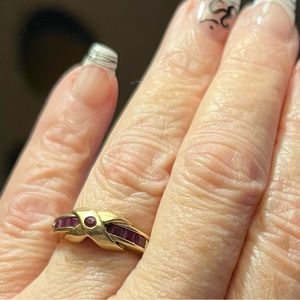 NINE true rubies  8 squares 1 ruby round set in a celtic knot of 10k gold.